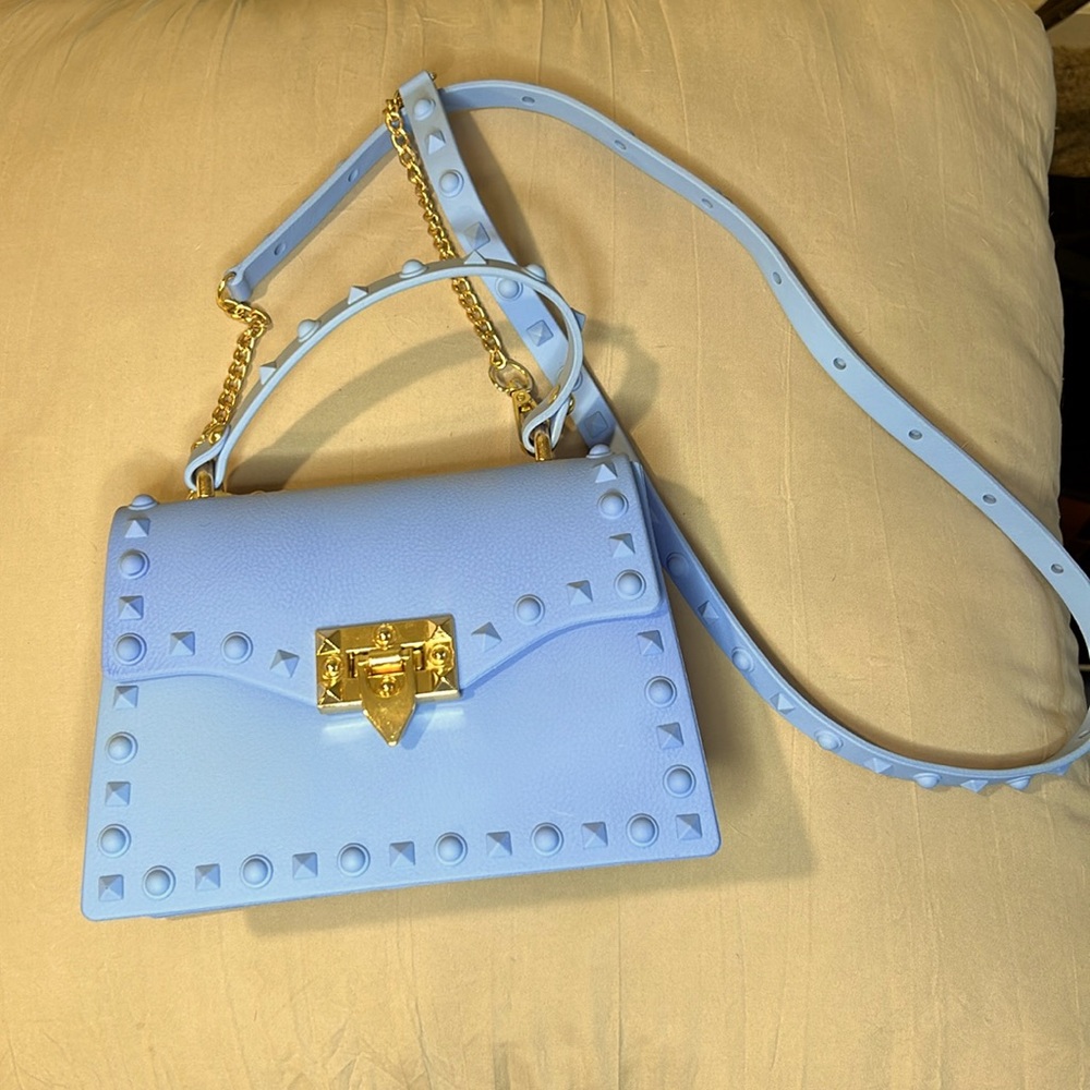 Chic baby blue purse with brass accents